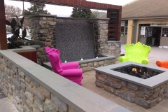 Wall Caps and  Firepit Coping with Ripple-Cut Waterfall