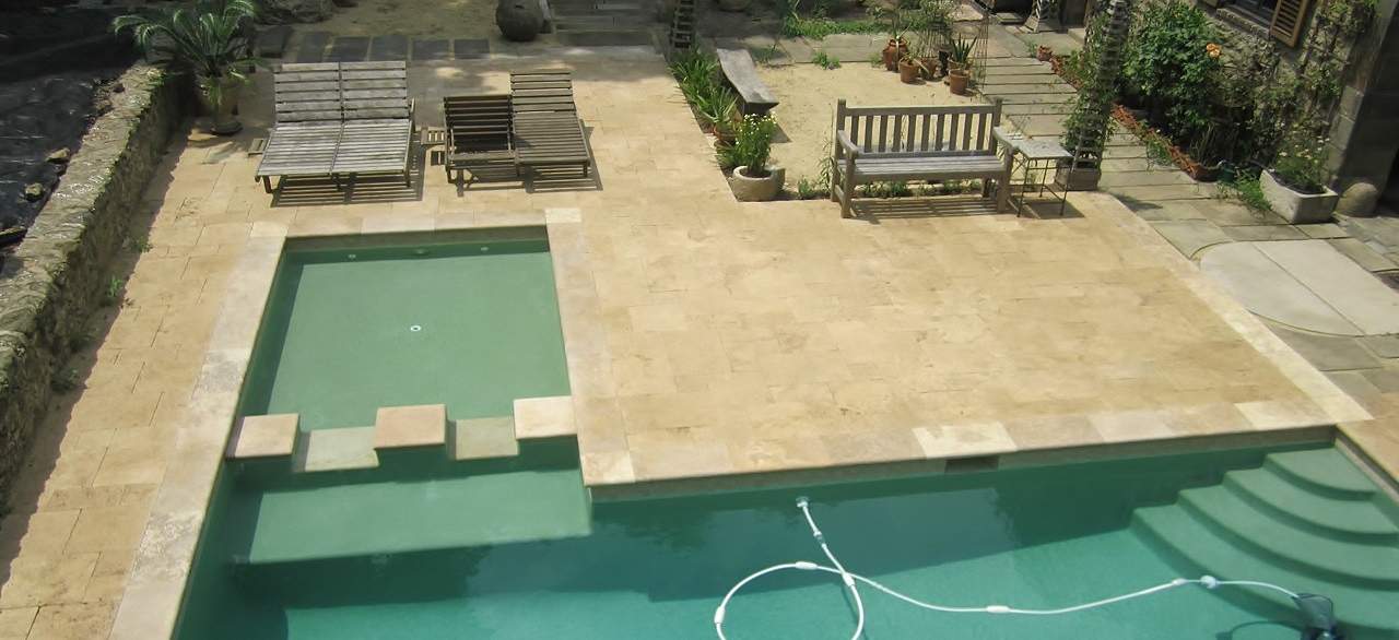 Beige Travertine pool deck and coping
